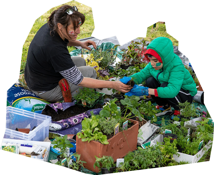 Cut out of woman and child potting plants